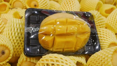 Yellow ripe mango in package at supermarket. Stock Footage 307052936