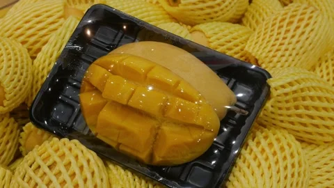 Yellow ripe mango in package at supermarket. Stock Footage 307097316