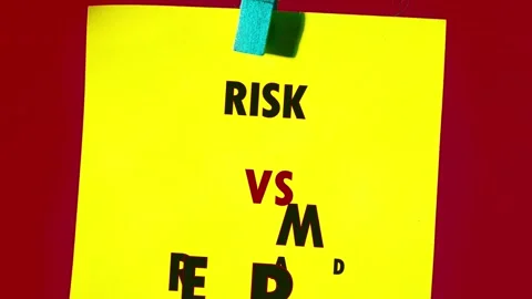 Yellow risk vs reward notes on red, some hung by blue clothespin on a string Stock Footage 331783826