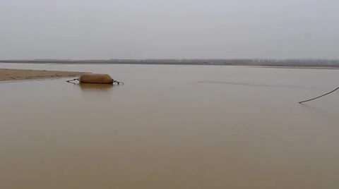 The yellow river, flowing peacefully in the winter Stock Footage 34881993