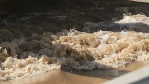 Yellow river spray closeup Stock Footage 157270366