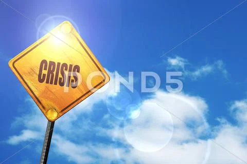 Yellow road sign with a blue sky and white clouds: Crisis sign b ...