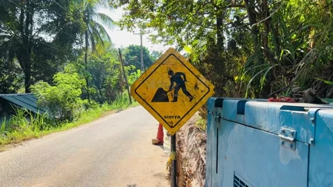 Yellow road sign warning about work on the road Stock Footage 233376064