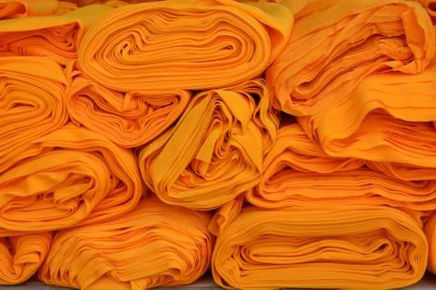 Yellow robe of Buddhist monk pattern background Stock Photos