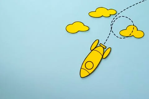 Yellow rocket looping around the clouds in the sky Stock Photos