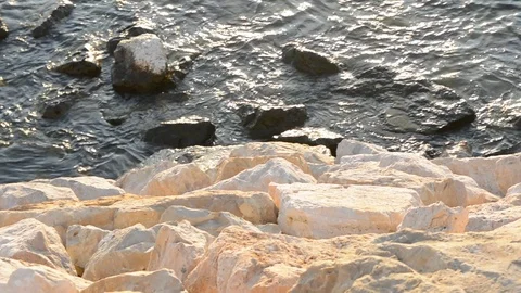 Yellow rocks at the sea side Видео 95572508