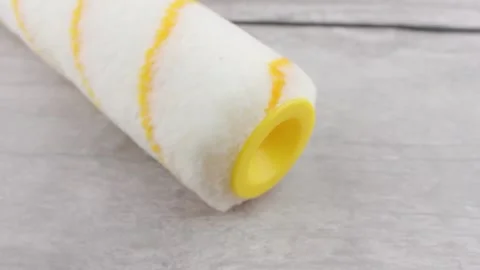 Yellow roller. Clean roller for repair work. Stock Footage 180021796
