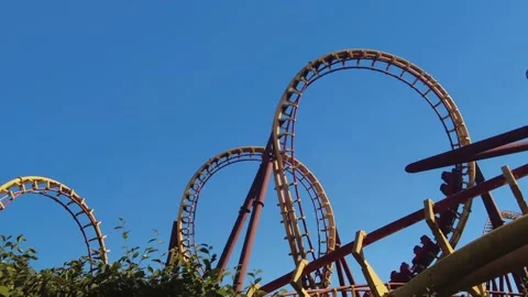 yellow roller coaster in amusement park ... | Stock Video | Pond5