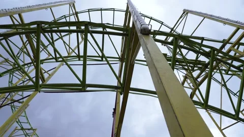 Yellow Roller Coaster Structure Viewed from Below 動画素材 287660407