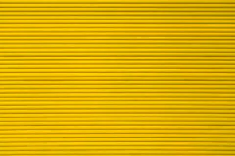 Yellow roller shutter for backgrounds and compositions Stock Photos