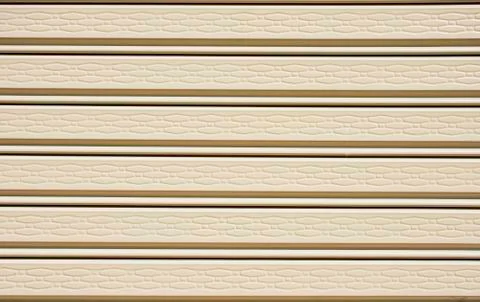 Yellow roller shutter gate  background Stock Photos