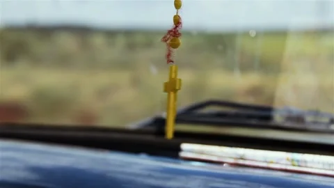 A Yellow Rosary Hanging in the Dashboard of an Old Pickup Truck. Close-Up.  Stock Footage 121940745