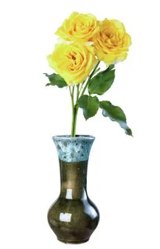 Yellow roses in a ceramic vase, isolate on a white background Stock Photos