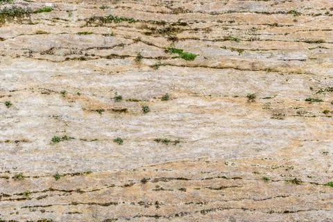 Yellow rough texture background wall bright broken cracked stone old surface Stock Photos