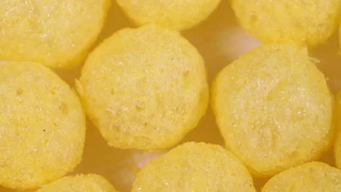 Yellow round corn balls spinning slowly. macro background Stock Footage 118468972