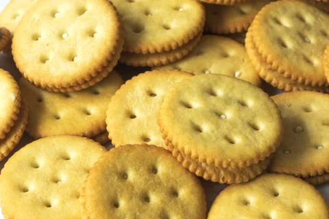 Yellow round crackers with cream inside Stock Photos