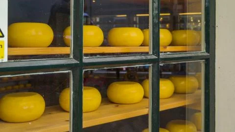 Yellow round objects being displayed in the glass cabinet Stock Photos