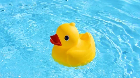 A yellow rubber duck can drift relaxed on the sparkling and crystal-clear wat Stock Footage 93643771