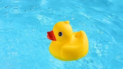 A yellow rubber duck can drift relaxed on the sparkling and crystal-clear wat Stock Footage 93643797
