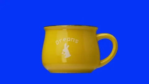 Yellow Rustic Metal Cup spinning in blue screen. Shot in 4K Stock Footage 151363073