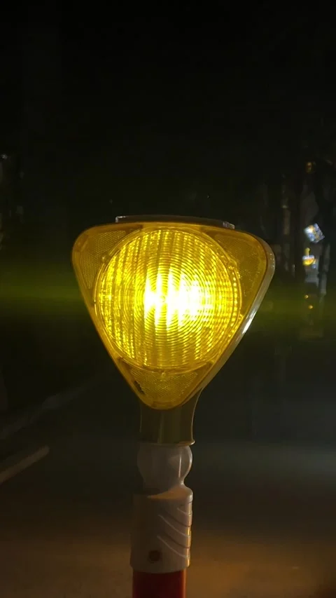 Yellow safety emergency caution light on construction site turns on and off Stock Footage 301525021