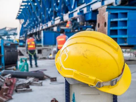 Yellow safety helmet with worker on express way construction site Foto stock