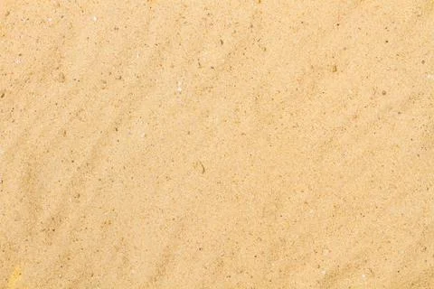 Yellow sand background in a close up view Stock Photos