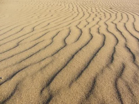 Yellow sand moved by the wind Stock Photos