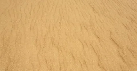 Yellow sand texture Stock Photos