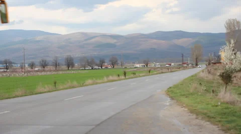 Yellow school bus drives down the road Stock Footage 37043992