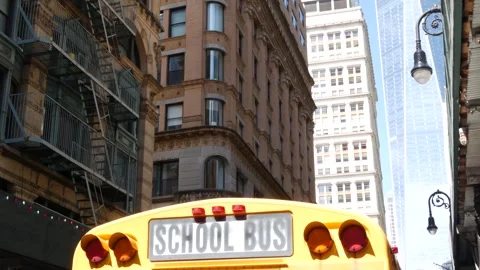 Yellow School Bus. Schoolbus on Fulton street, New York City Manhattan Downtown Stock Footage 293274470