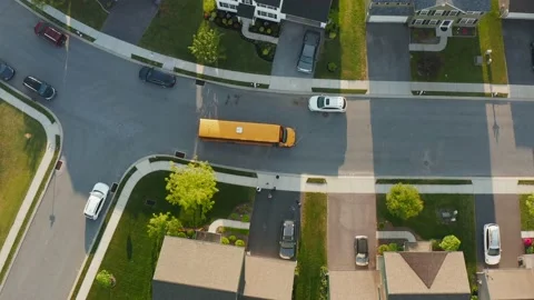 Yellow school bus. Top down birds eye aerial of kids children and students Stock Footage 155297450