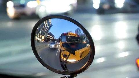 Yellow schoolbus in rearview mirror Driving on Street of Toronto Stock Footage 112031188