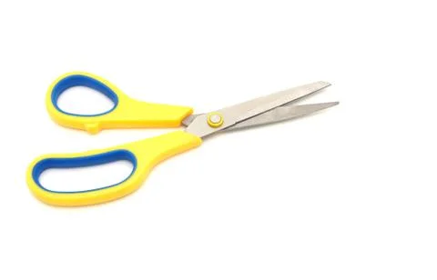 Yellow scissors isolated on a white background Foto stock