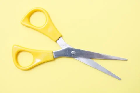 Yellow scissors Stock Photos