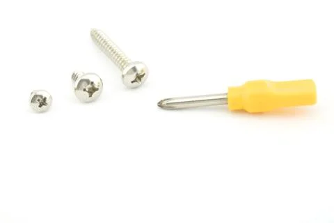 Yellow screwdriver with screw Stock Photos