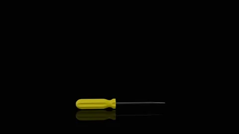 Yellow Screwdriver turns on itself Stock Footage 239381763