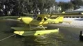 Yellow Seaplane By Small Cove Beach HD Footage