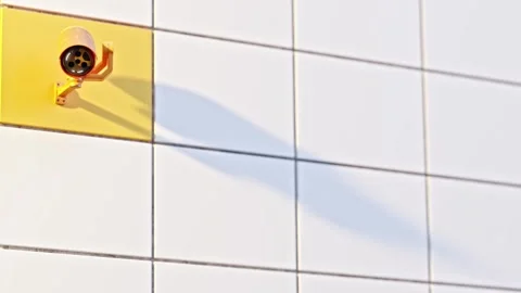 Yellow Security CCTV camera. Scan the area for surveillance purposes. Stock Footage 269455699