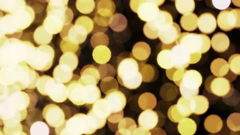 Yellow shining light particles bokeh rendered as looping motion background Stock Footage 164320392