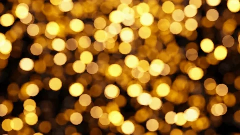 Yellow shining light particles bokeh rendered as looping motion background Stock-Footage 165498849