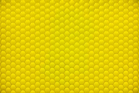 Yellow shiny hexagon bubble tile texture background Illustrazione stock