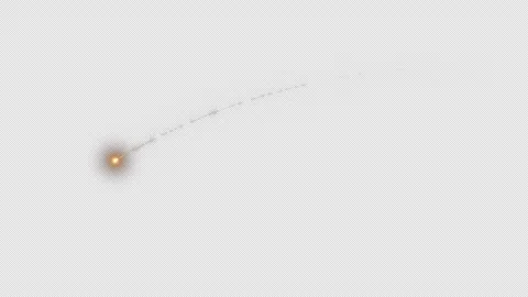 A yellow shooting star trailing a sparkling tail as it streaks across the sky Stock Footage 332255712
