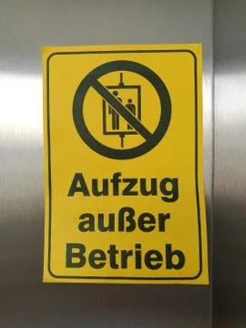 Yellow sign with the note Elevator Out of service Detail with German Word Aufzug Stock-Fotos