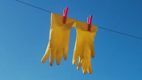 Yellow silicon Rubber gloves Stock Footage 258932375