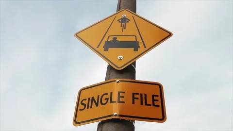 Yellow single file caption rectangle sign with yellow diamond sign above it Stock Footage 246611568