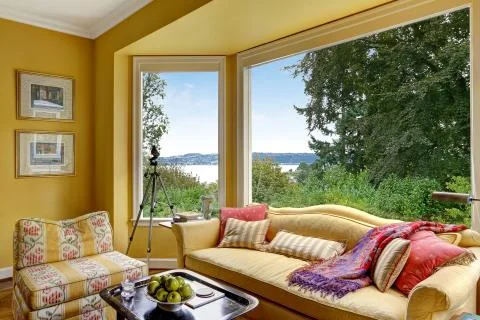 Yellow sitting area  with large window Stock Photos