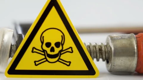 The yellow skull hazard sign on the side of the clamp Видео 129457764