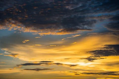Yellow sky cloud / Dramatic sunset colorful yellow sky over and cloud backgro Stock Photos