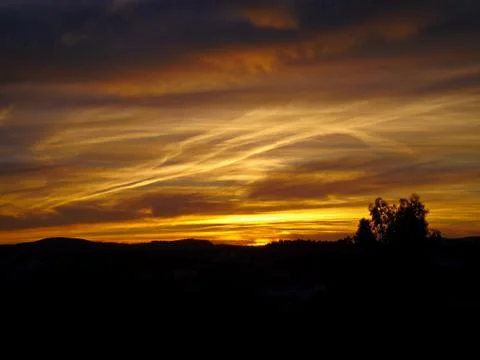 Yellow sky during a sunset Stock Photos